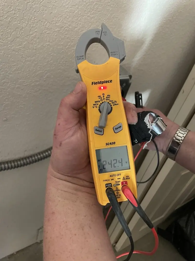 Voltage testing with clamp meter during Outlet Installation in Somerset